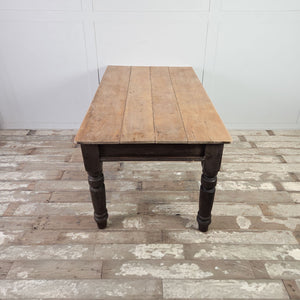 Antique Victorian farmhouse table with four plank sycamore top and dark painted pine base on chunky turned legs.
