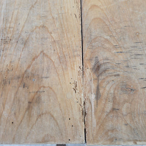 Victorian farmhouse kitchen table featuring a four plank sycamore top above a dark painted pine base with chunky turned legs.
