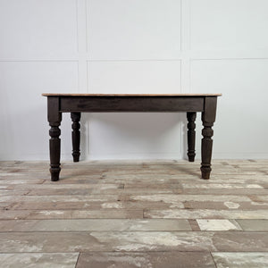 Victorian 19th Century dining table with sycamore plank top over a dark painted pine base and chunky turned legs.
