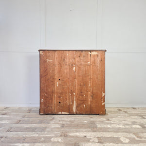 Antique pine cottage style chest of drawers with five graduating drawers and turned wooden knobs
