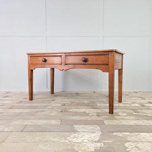 Antique rustic pine serving table with a scrub plank top and matching turned wooden drawer knobs